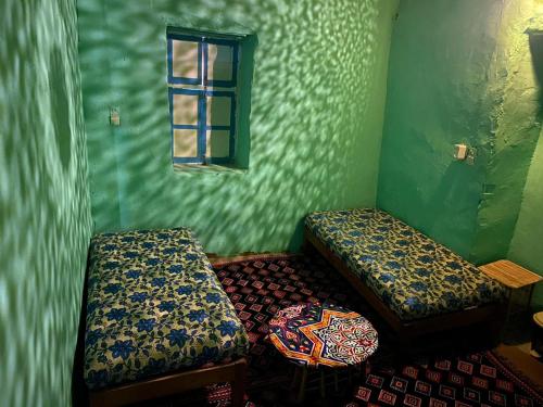 A bed or beds in a room at Humble Nubia