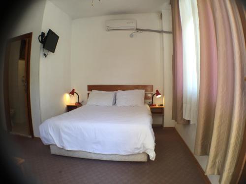 מיטה או מיטות בחדר ב-Hotel Efes