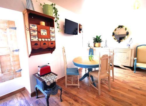a dining room with a table and chairs at Vida à portuguesa, Charming apartment "Algarve" , in the cultural and historical center in Portimão