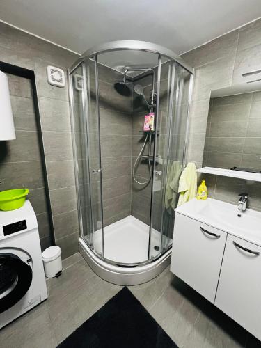 a bathroom with a shower and a sink at Central Moon Apartment no.1 in Split
