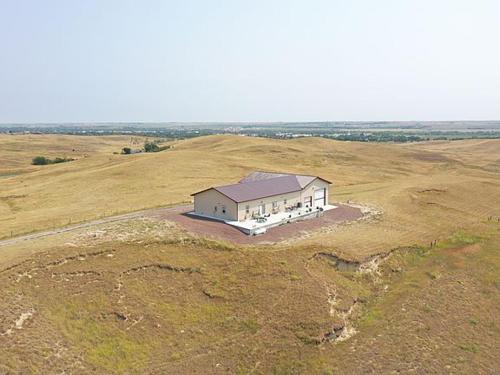 an aerial view of a house in the middle of a field at MJSmith Rentals in Ogallala