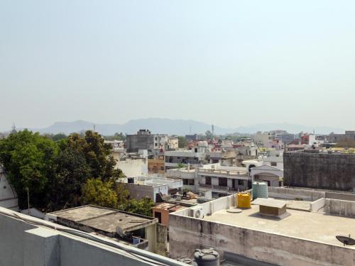 a view of a city from the roof of a building at Collection O Hotel Divine Ganges in Haridwār