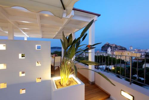 a balcony with a plant in a planter at Hotel Villa Durrueli Resort & Spa in Ischia