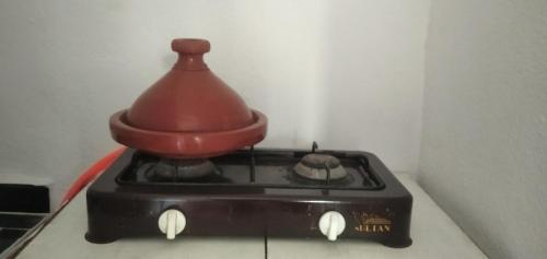a kitchen appliance with a pot on top of it at Suite appartement in Fès