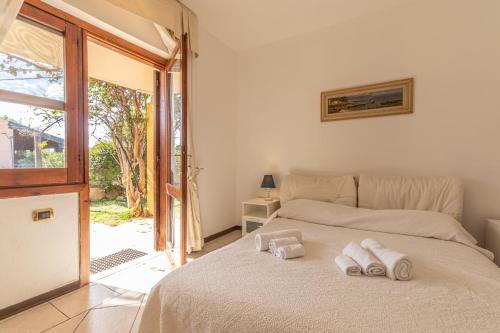 Postel nebo postele na pokoji v ubytování Baia Turchese Olbia