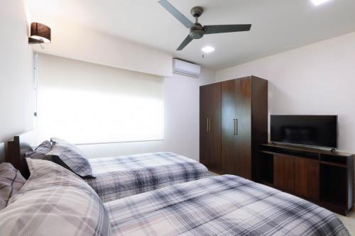 Katil atau katil-katil dalam bilik di La Poza Suites