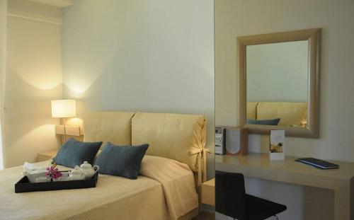 Postel nebo postele na pokoji v ubytování Ionian Coco Palm Beach Villas