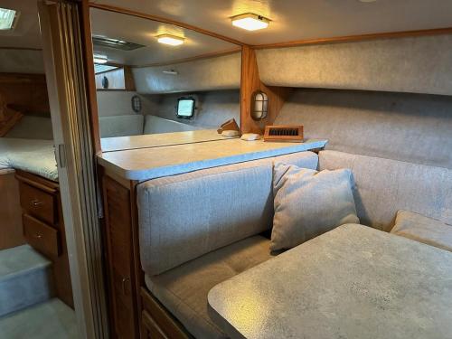 a small room with two seats and a table at Annapolis Boat Life - Overnight Stays in Annapolis