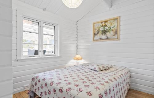 a white bedroom with a bed and a window at Cozy Home In Skibby With Kitchen in Skibby