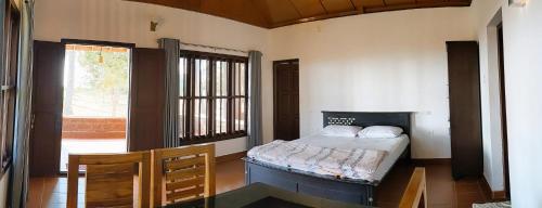 Letto o letti in una camera di Baycliff Cottages
