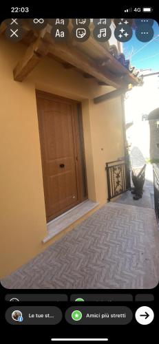 a screenshot of a home with a door on the screen at La Casa di Rita in Fogliano