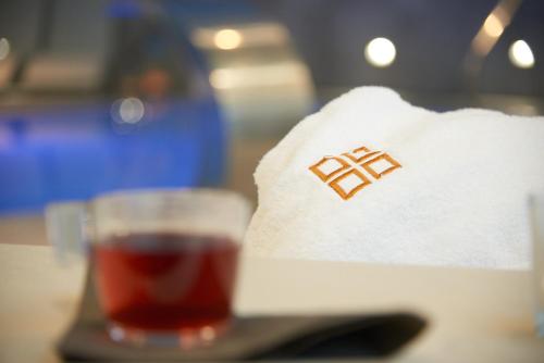 a glass of beer and a napkin with a drink at Forte16 View & SPA in Florence