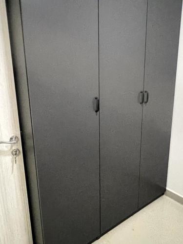 a pair of gray lockers in a room at City Focus in Muscat