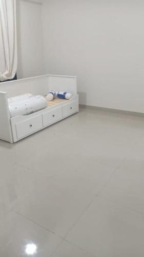 a white shelf with some objects on it at City Focus ابراج المهلب in Muscat