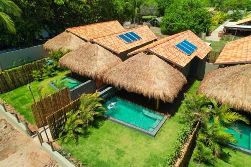 an aerial view of a resort with a swimming pool at Pousada Tatuá in Pôrto de Pedras