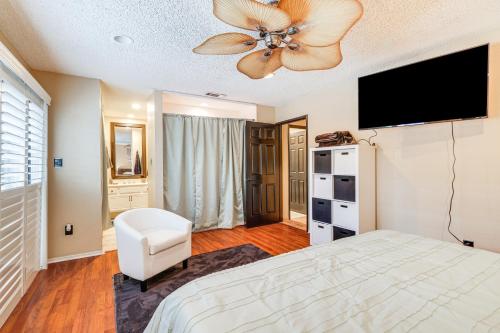 a bedroom with a bed and a ceiling fan at Modesto Vacation Home 6 Mi to Downtown! in Modesto