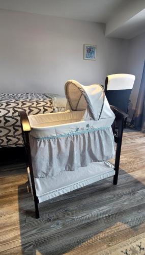a bed sitting in a room with at Cozy Private Suite in Winnipeg