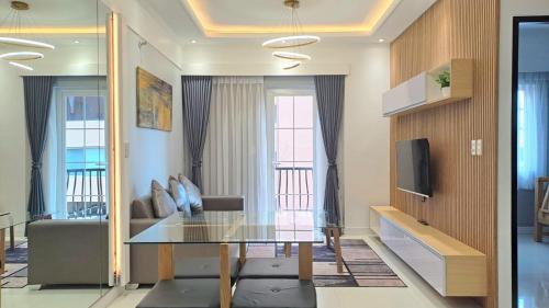 a living room with a glass table and a couch at 88 Gibraltar (Mines View) in Baguio