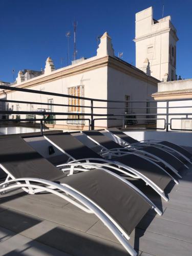 a building with a ramp in front of a building at Apartamentos GADIR CENTRO in Cádiz