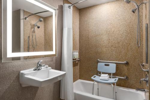 a bathroom with a sink and a shower and a tub at La Quinta by Wyndham Mt. Laurel - Philadelphia in Mount Laurel