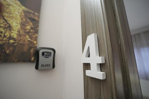 a close up of a door with a number on it at Casa di Paola in Palermo