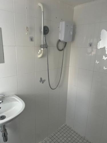 a bathroom with a shower and a sink at Private Room in Basildon in Vange