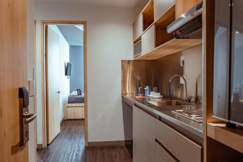 Cuisine ou kitchenette dans l'établissement UMA Suites Chia