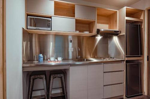 Cuisine ou kitchenette dans l'établissement UMA Suites Chia