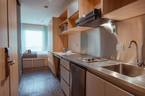 Cuisine ou kitchenette dans l'établissement UMA Suites Chia