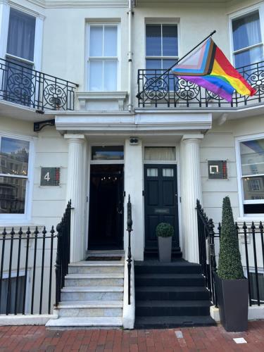 a kite flying on the balcony of a house at Square Townhouse in Brighton & Hove