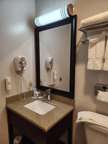 a bathroom with a sink and a mirror at Comfort Inn Yreka I-5 in Yreka