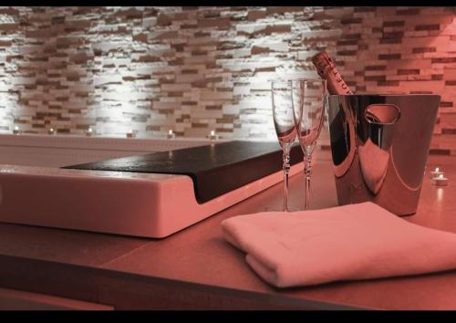 a counter top with a wine glass and a napkin at Il Campanile Premium B&b in Altamura