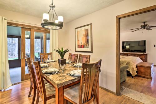 a dining room with a table and chairs at Near Big Boulder Mtn Cabin with Furnished Deck in Albrightsville