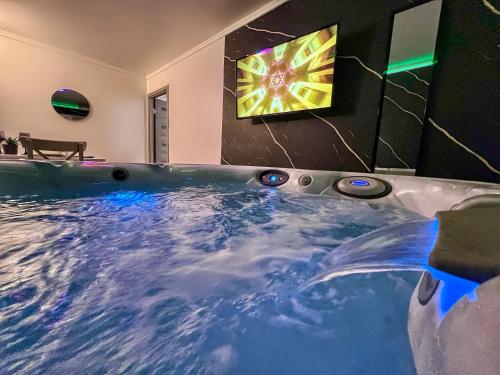 a large jacuzzi tub in a room at Luxor - Jacuzzi&Cozy Apartments in Sibiu