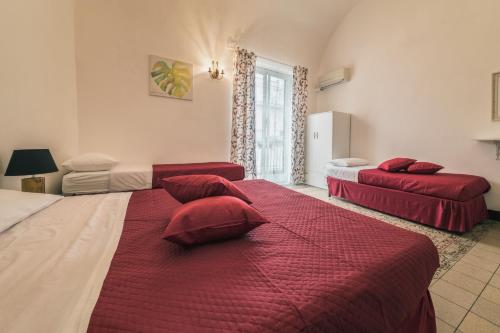 Voilà Rooms Guest Houseにあるベッド