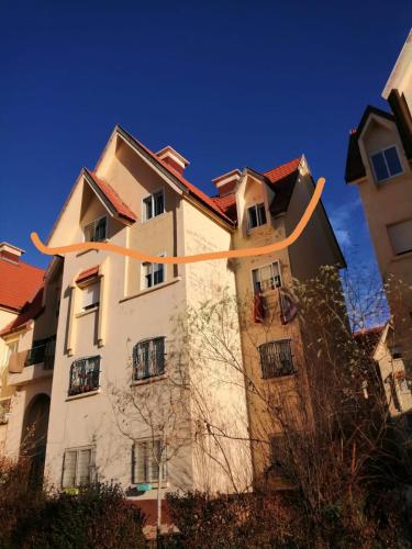 a building with an orange ribbon on it at Appartement Jardin d'Ifrane in Ifrane