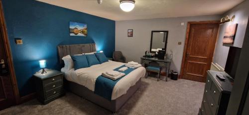 Ένα ή περισσότερα κρεβάτια σε δωμάτιο στο Station Inn B&B