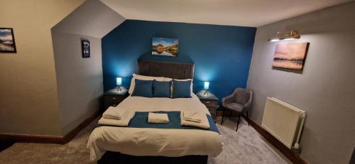 Ένα ή περισσότερα κρεβάτια σε δωμάτιο στο Station Inn B&B
