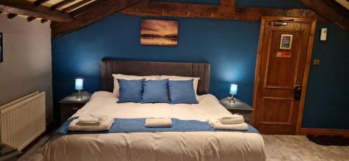 Ένα ή περισσότερα κρεβάτια σε δωμάτιο στο Station Inn B&B