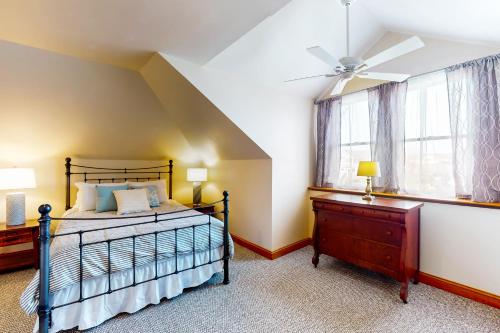 a bedroom with a bed and a window at Vitamin Beach 12 in Avon
