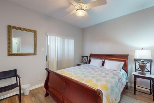 a bedroom with a bed and a ceiling fan at Mariner Village 108 in Seabrook