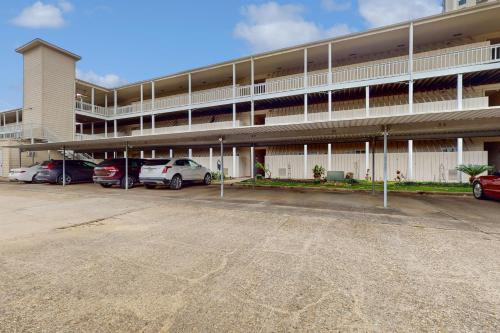 a parking lot in front of a large building at Mariner Village 108 in Seabrook