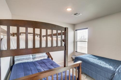 a bedroom with a bunk bed next to a bed sidx sidx sidx at Bullhead City Home with Mtn View, By Colorado River in Bullhead City