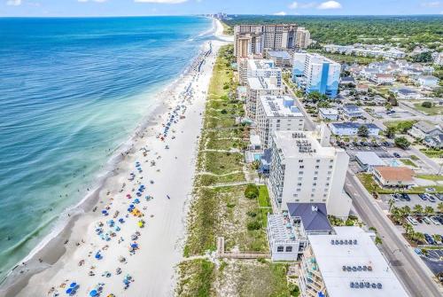 an aerial view of a beach with buildings and the ocean at Family friendly spacious Barefoot townhome in North Myrtle Beach
