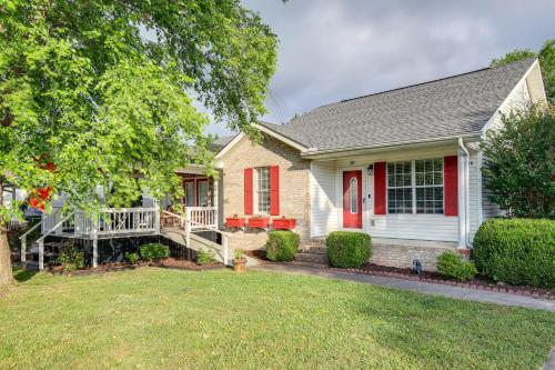 a house with a red door and a porch at Cozy home near Pigeon Forge attractions in Pigeon Forge