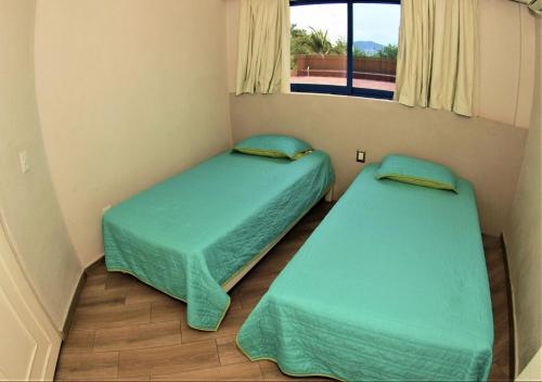 Кровать или кровати в номере Hotel Marina Puerto Dorado - Todo Incluido