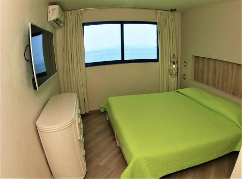 Кровать или кровати в номере Hotel Marina Puerto Dorado - Todo Incluido