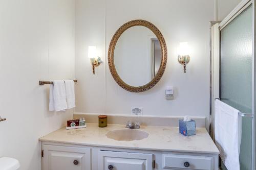 a bathroom with a sink and a mirror on the wall at Pet-Friendly Higden Getaway Less Than 1 Mi to Marina! in Fairfield Bay