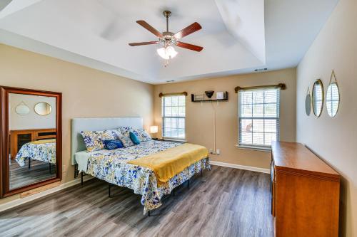 a bedroom with a bed and a ceiling fan at Prattville Home with Fire Pit - 2 Mi to Downtown! in Prattville