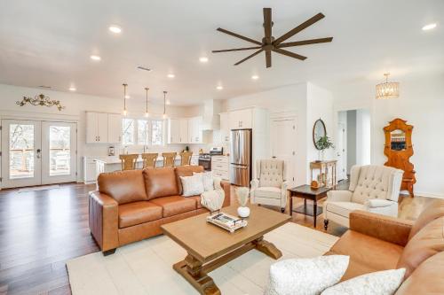 a living room with a couch and a table at The Hamilton Heber Springs Home with Hot Tub! in Heber Springs